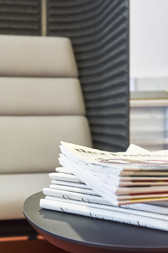 Newspaper reading corner on the gallery